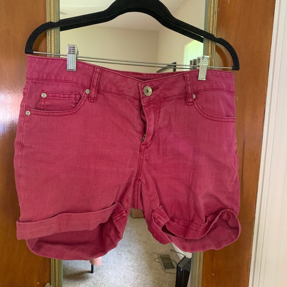 Red cuffed hem shorts with rear button flap pockets